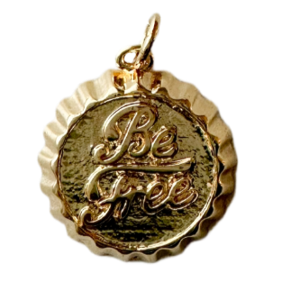 Gold bottle cap with "Be Free" on the front
