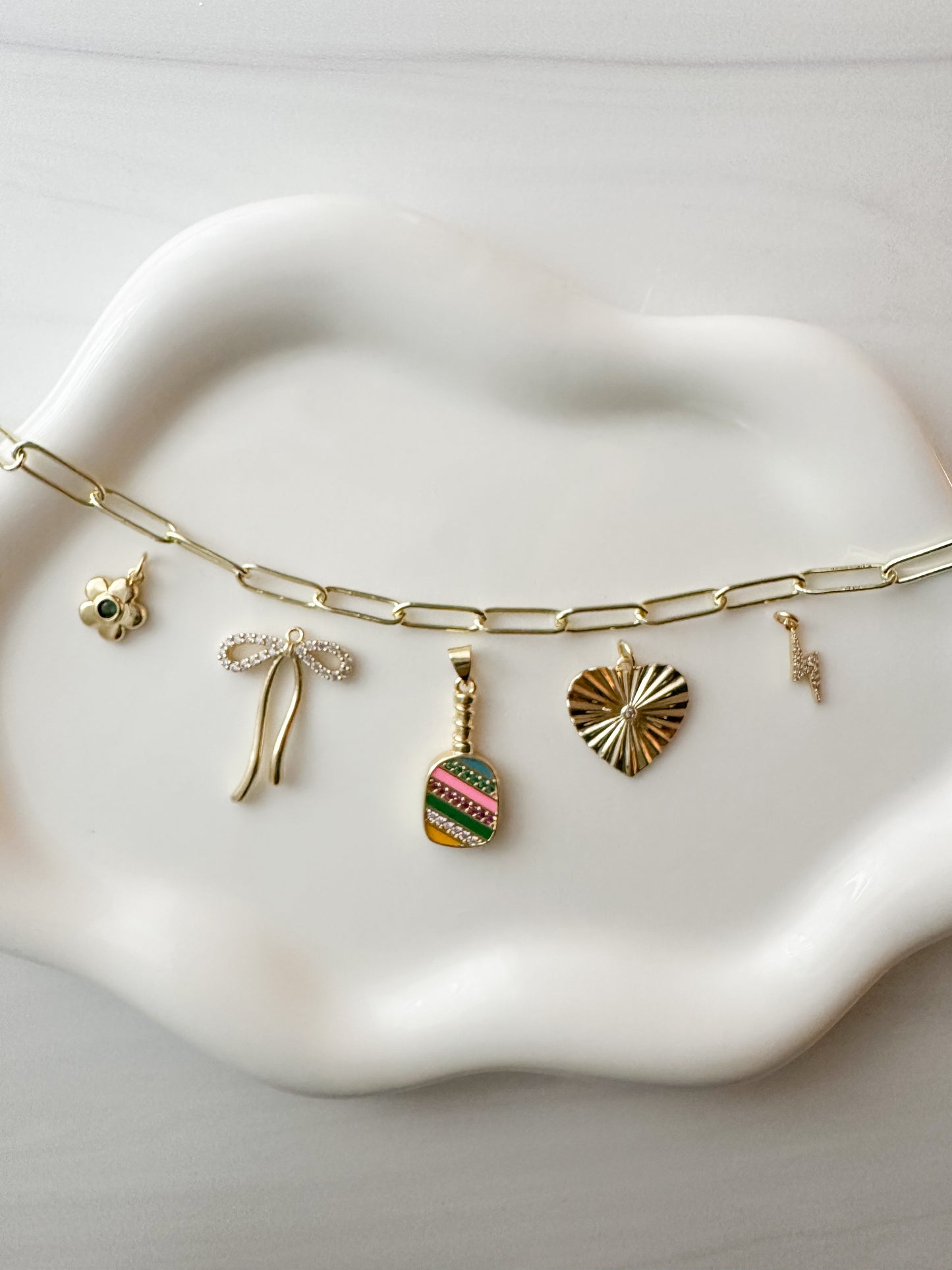 Design personalized charm bracelets and necklaces from home