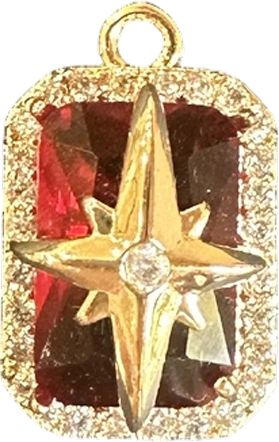 Gold north star charm on red stone with crystal halo